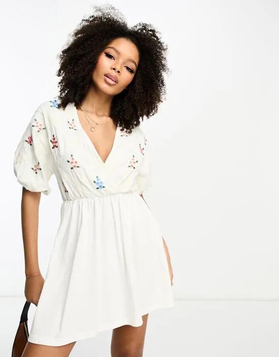 smock mini dress with cross lace insert and embroidery in cream