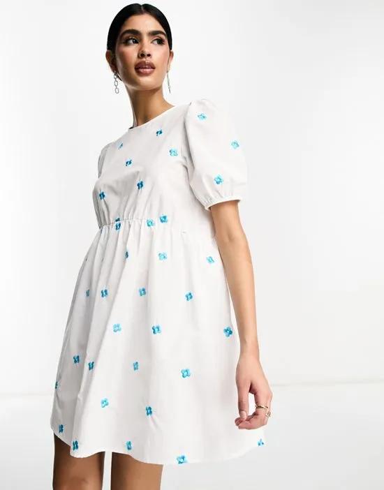 smock mini dress with embroidered blue flowers in white