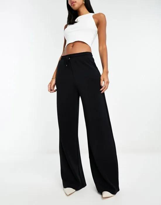 soft touch flare sweatpants in black