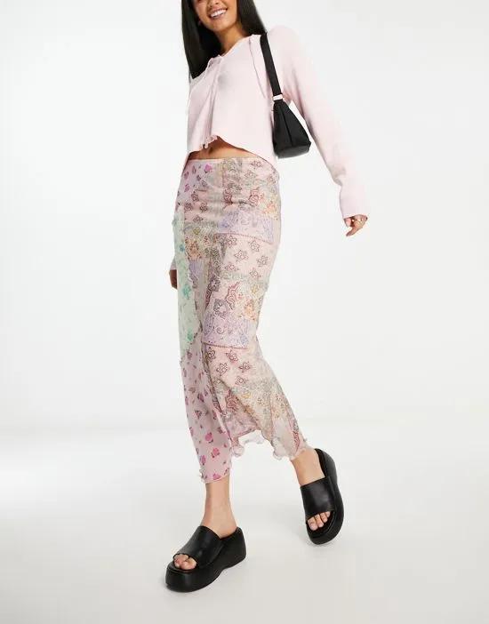 spliced midi skirt with asymmetric hem in floral print