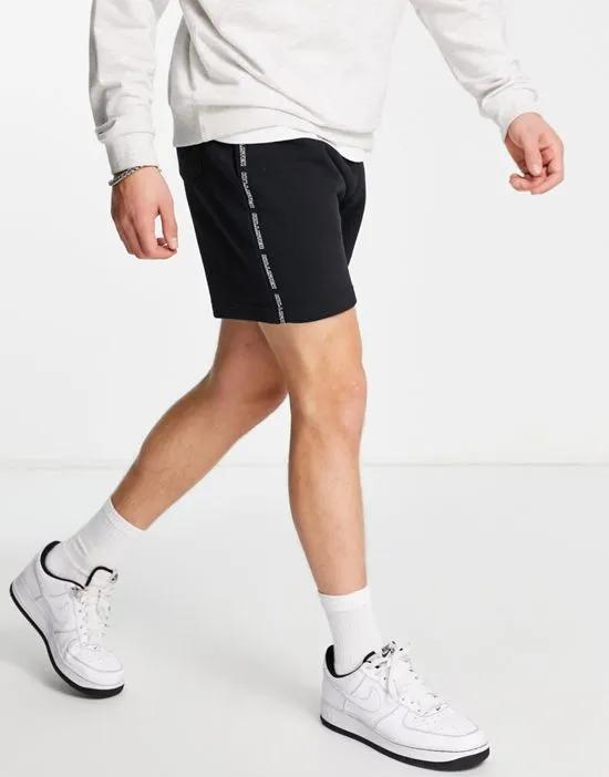 sports tape logo sweat shorts in black