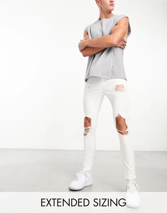 spray on jeans with power stretch with heavy rips in white
