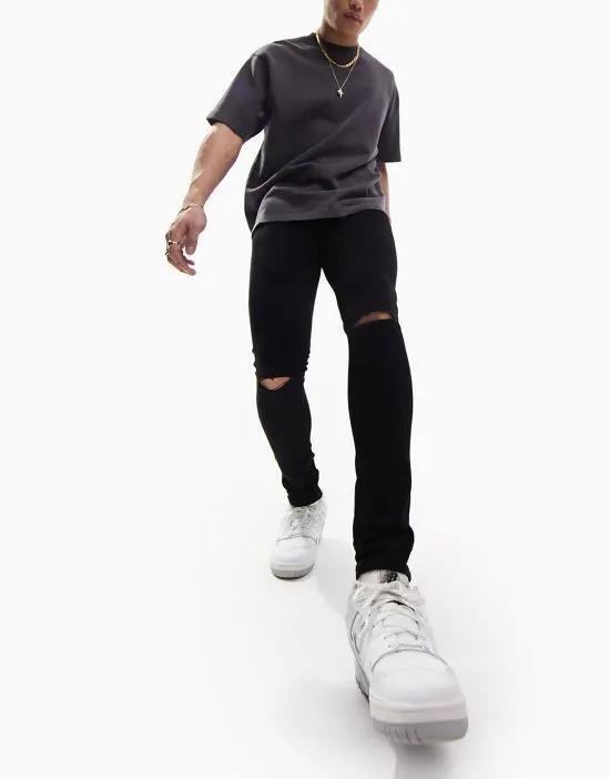 spray on jeans with power stretch with knee rips in black