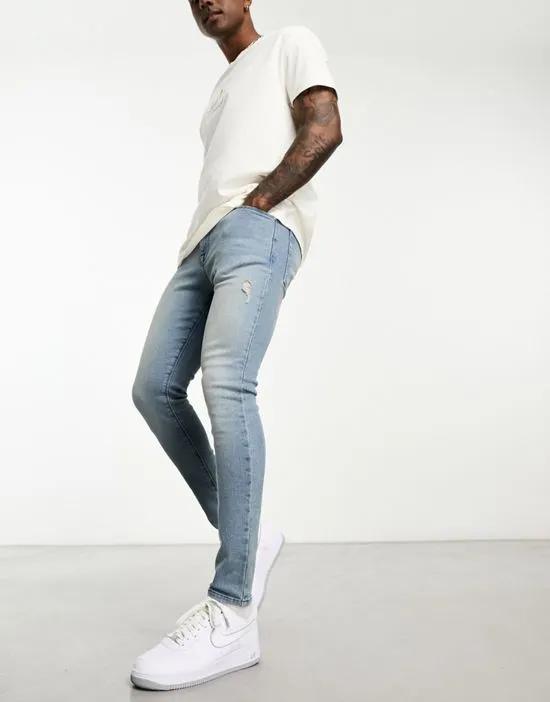 spray on jeans with power stretch with rips in blue