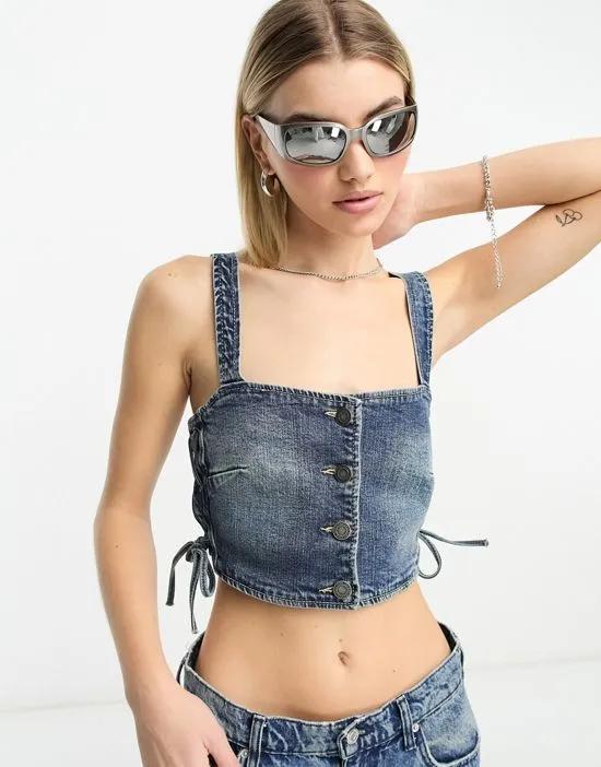 STR denim crop top with lace up side in washed blue
