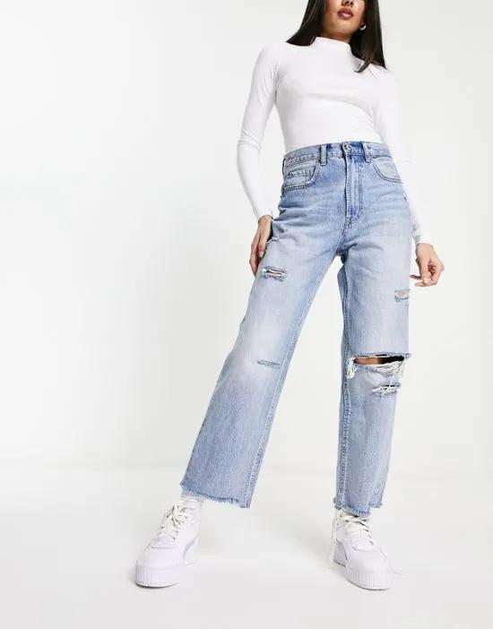 straight cropped jean with rips in medium blue