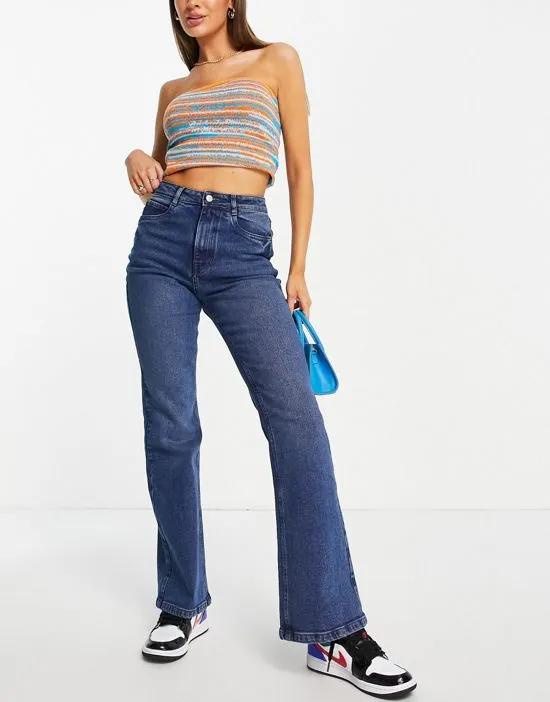 straight flare jeans in mid wash blue