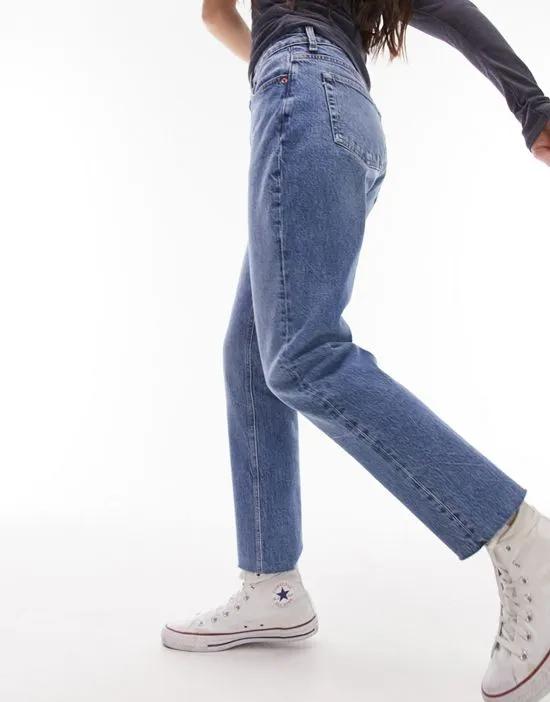 straight jeans with raw hem in mid blue