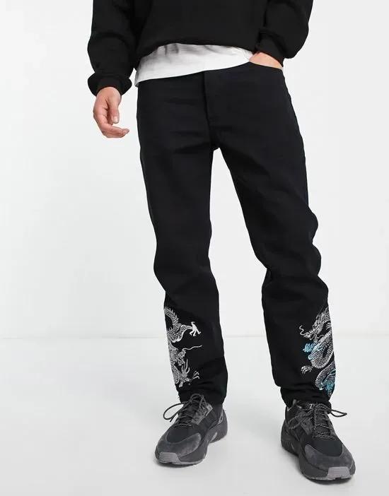 straight leg denim jeans in black with dragon embroidery