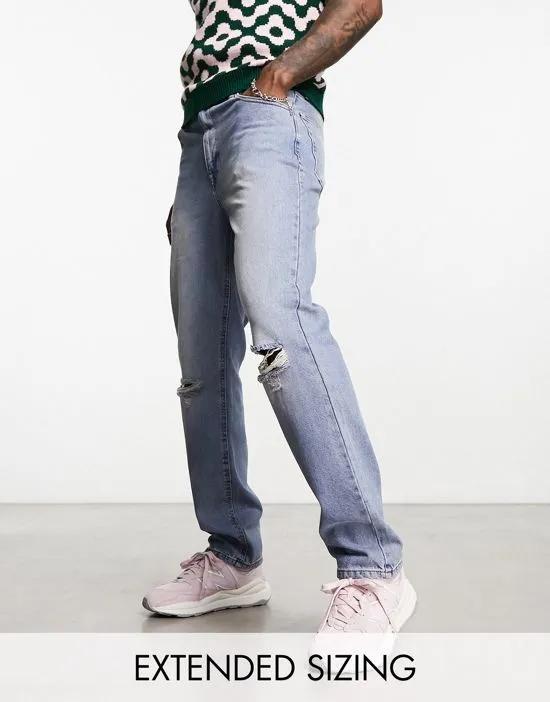straight leg jeans with busted knee in mid blue wash