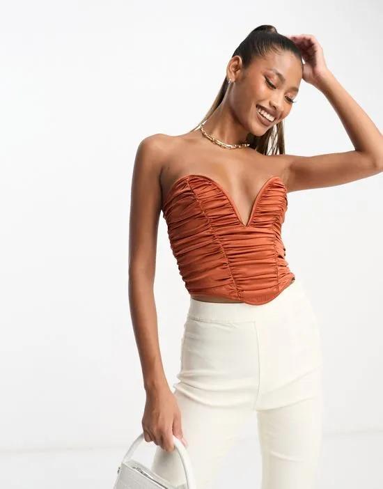 strapless ruched corset top with plunge v in rust