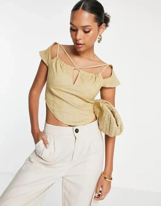 strappy cross neck top with capped sleeve and ruched keyhole detail in sand