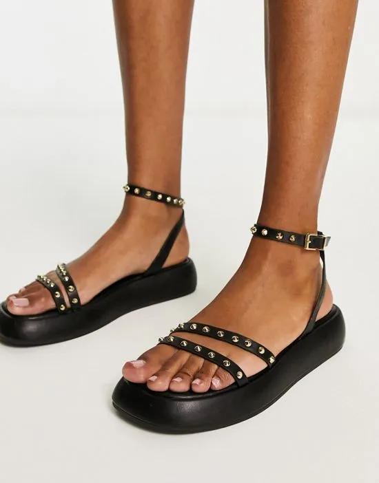 strappy cross over flatform sandal in black