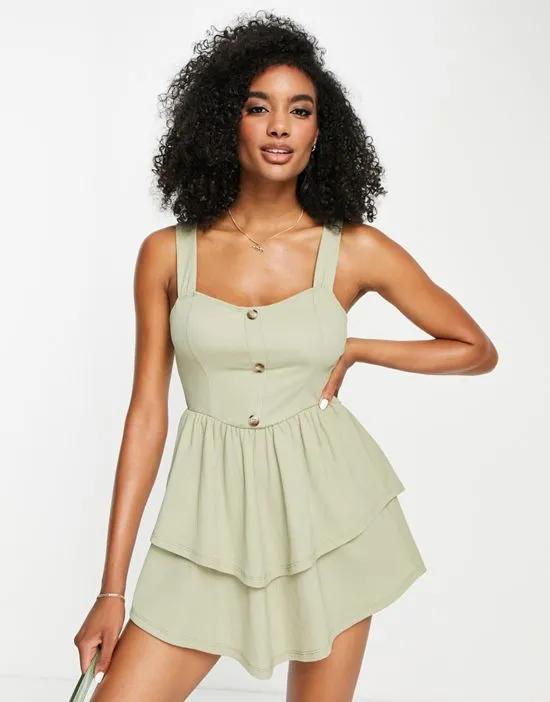 strappy mini dress with ra ra skirt and buttons in sage green