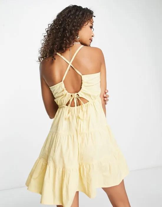 strappy open back tiered mini dress in lemon