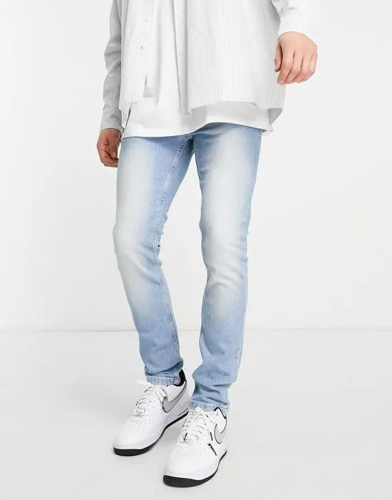 stretch skinny jeans in light wash blue