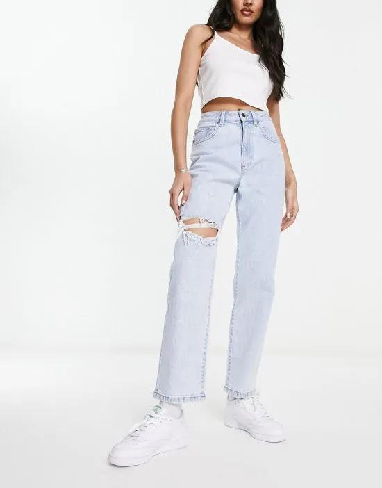 stretch straight jeans with rips in bleach wash