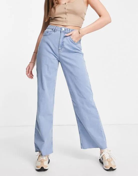 stretch wide leg jeans with raw hem in light blue wash