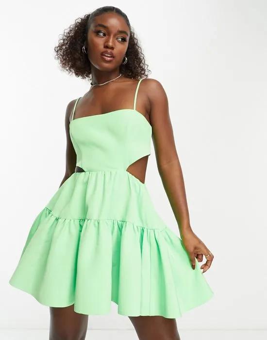 structured cut-out mini dress with pockets in vibrant green