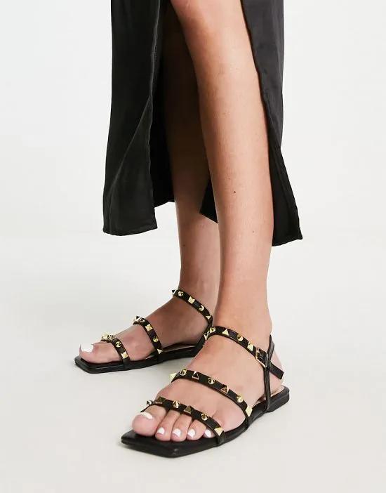 studded strappy flat sandals in black