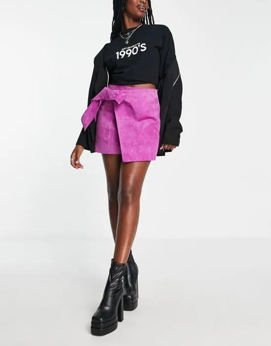 suede wrap mini skirt with tie detail in magenta