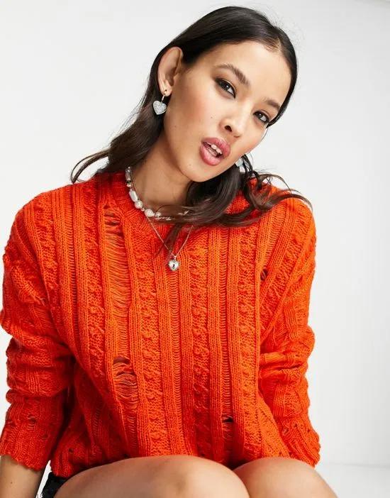 sweater with cable and ladder stitch in orange