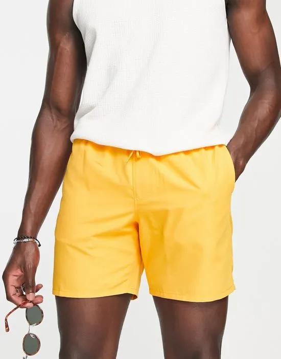 swim shorts in mid length in orange