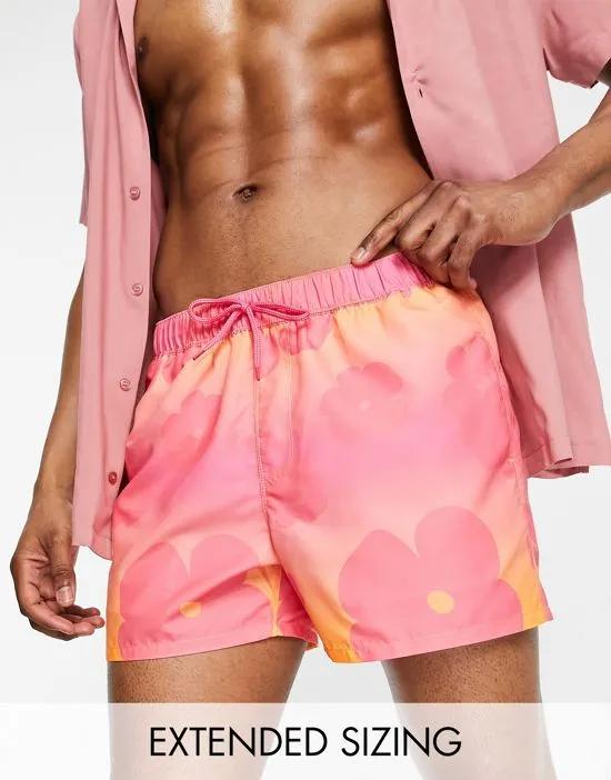 swim shorts in short length with faded floral print in pink