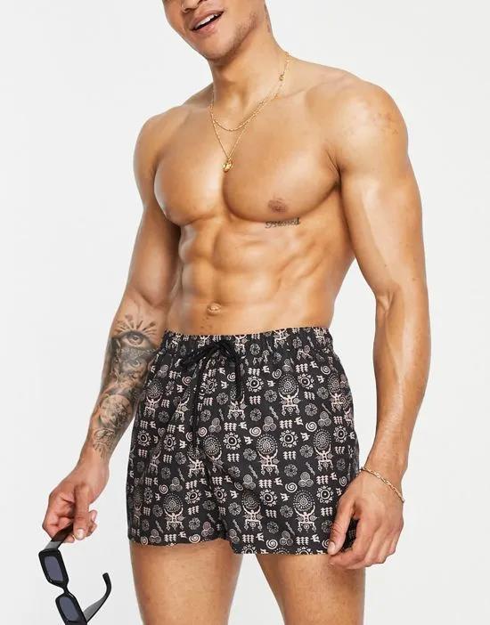 swim shorts in short length with hand drawn design in black