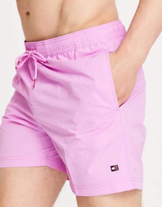 swim shorts with small flag logo in purple