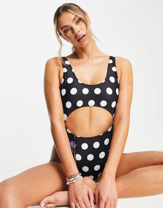 swimsuit with cut out in black polka