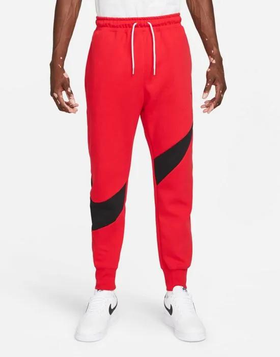 Swoosh Pack cuffed sweatpants in red