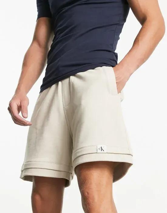 tab logo shorts in beige - part of a set