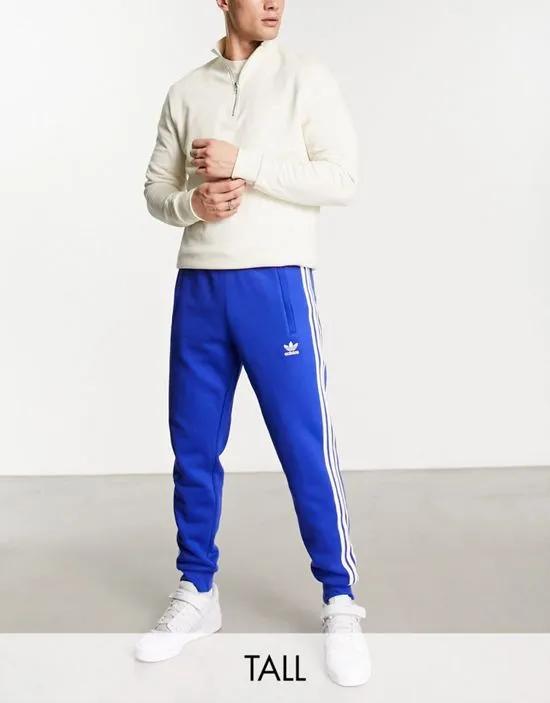 tall 3-Stripes sweatpants in blue