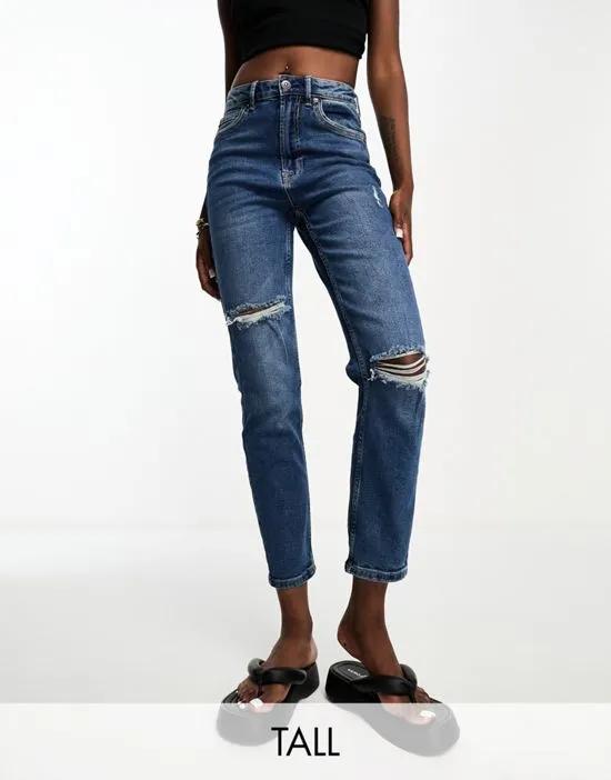 Tall slim mom jean with stretch and rip in medium blue