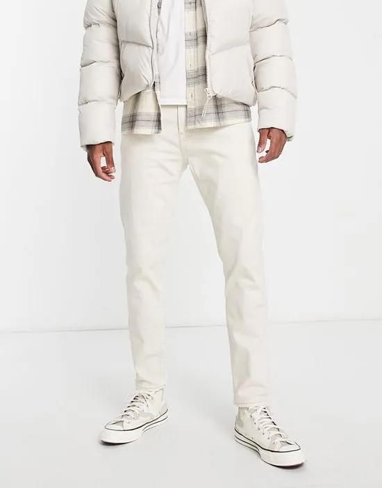 tapered jeans in off white