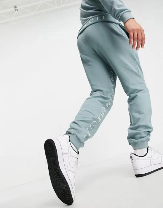 tapered sweatpants with Roman numerals inside tape in blue gray - part of a set
