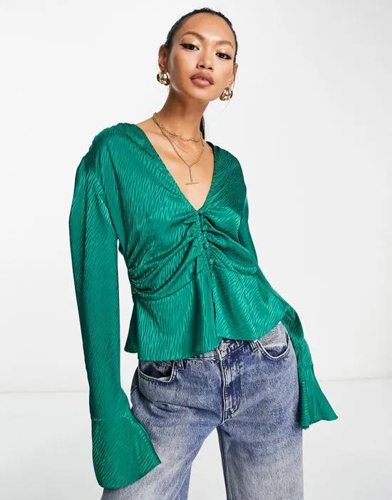 tee blouse with ruched waist & neck tie in green jacquard
