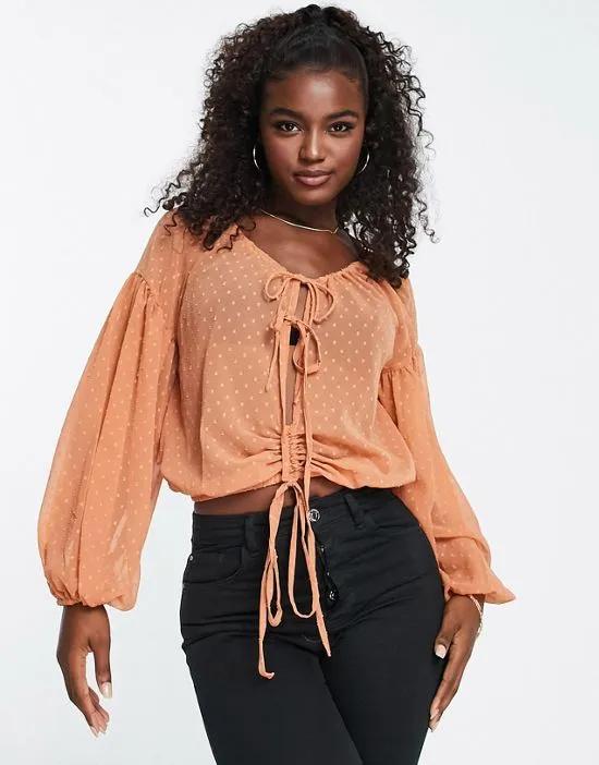 textured blouse with volume long sleeve with tie front in orange