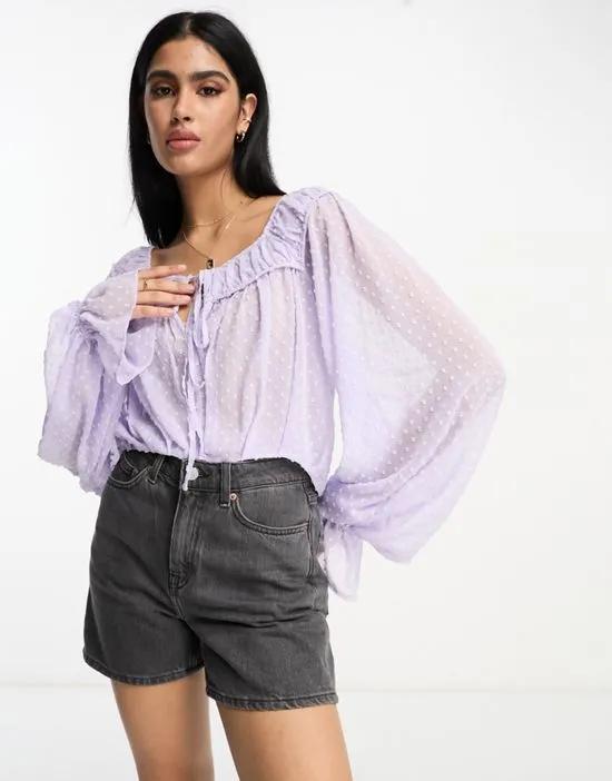 textured blouse with volume sleeves & tie front in lavender