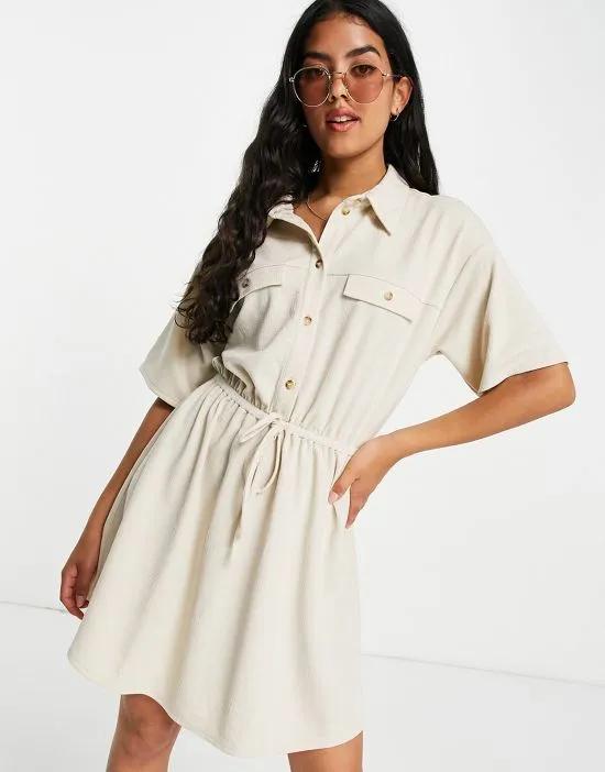 textured mini shirt dress with horn buttons in cream