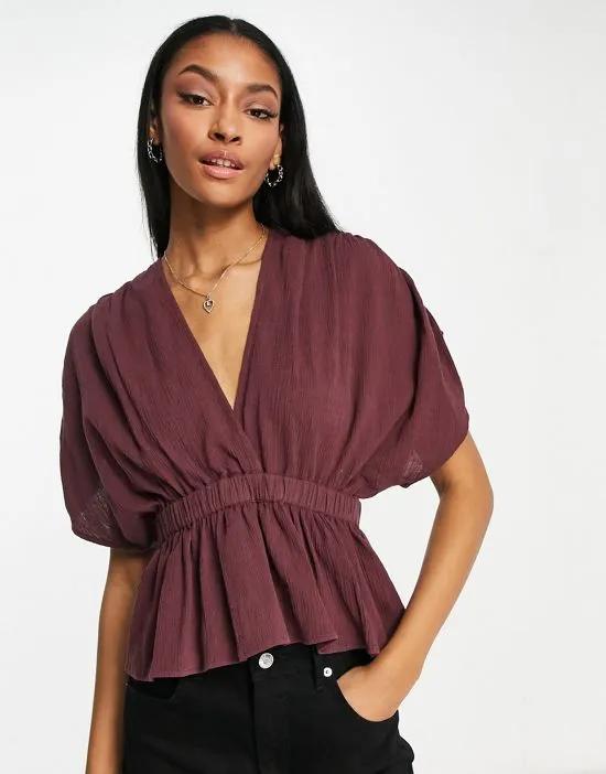 textured plunge front top with elastic waist detail in chocolate