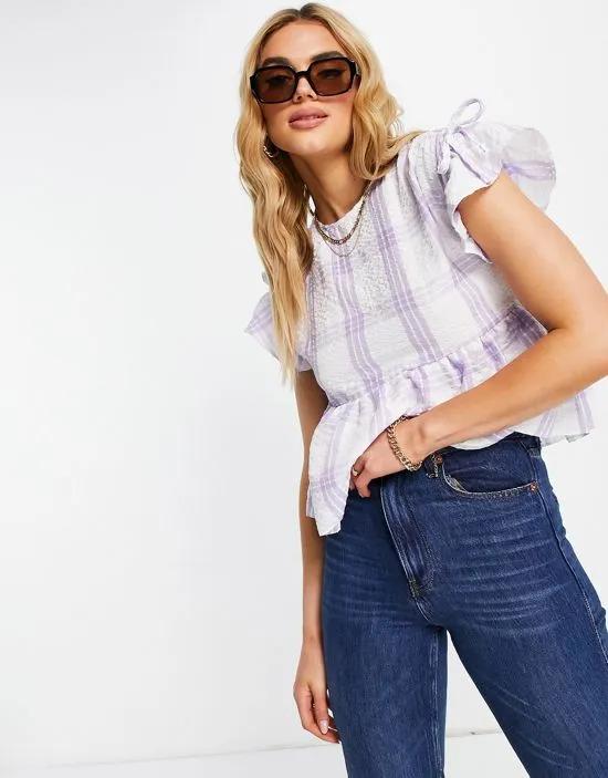 textured smock top with ruffle sleeve in lilac check