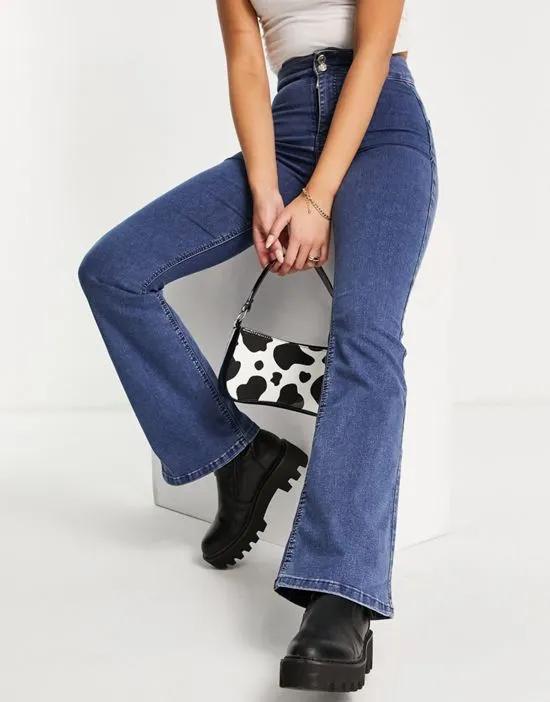 Three stretch flared jeans in mid blue