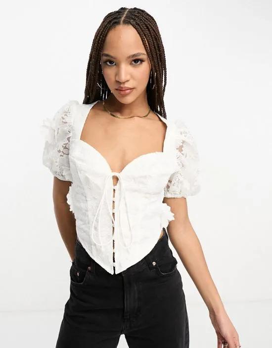 tie front corset top with puff sleeves in white 3D floral lace