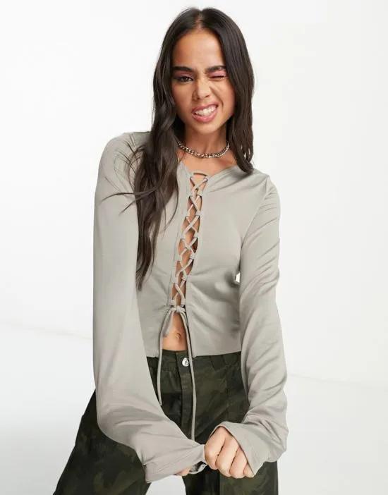 Tie long sleeve top with lace front in stone