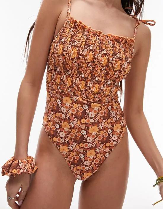 tie-shoulder shirred swimsuit in brown ditsy floral with matching scrunchie