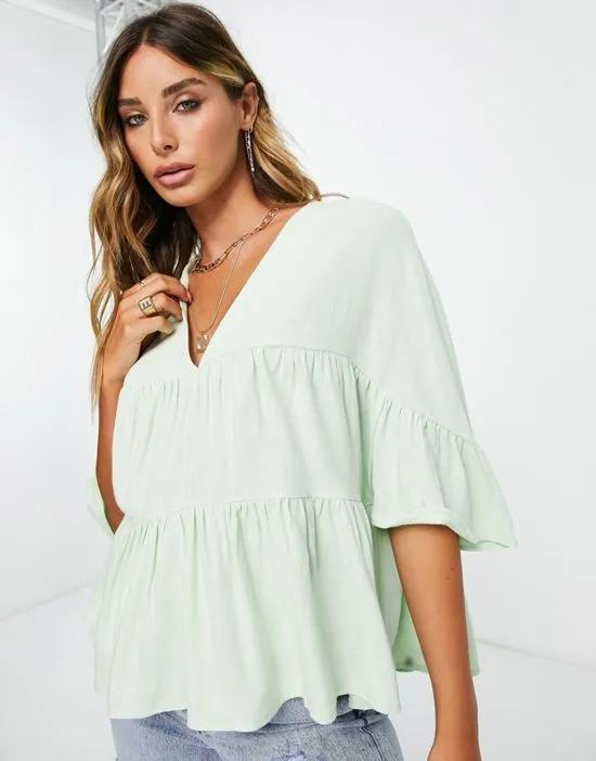 tiered smock top with ruffle sleeves in apple