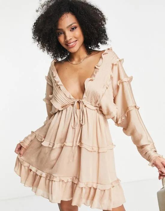 tiered soft mini dress with pleated panels and tie front in blush