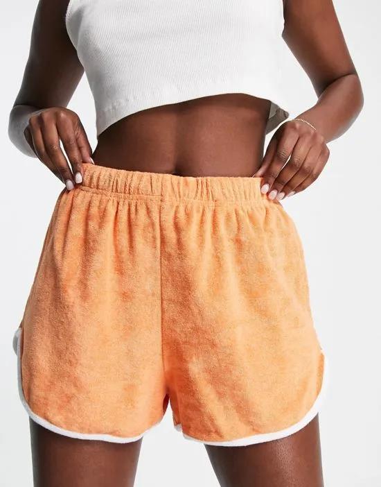 Towelling runner short with piping in orange
